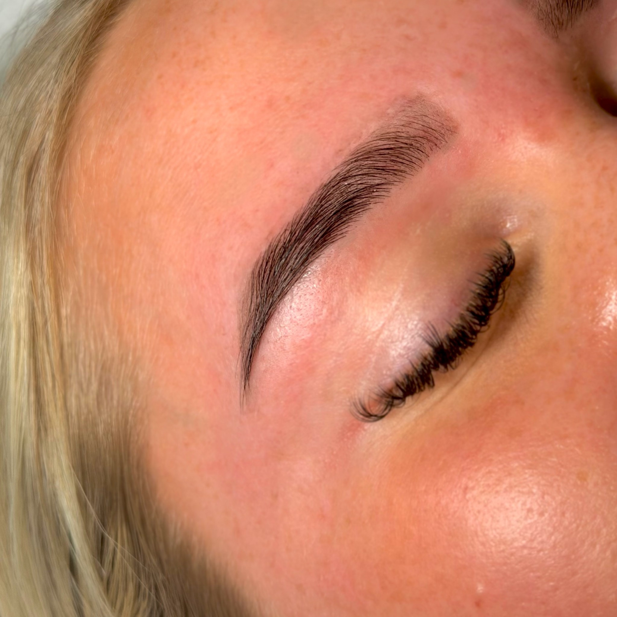 A freshly shaped and tinted brow after a brow wax and tint