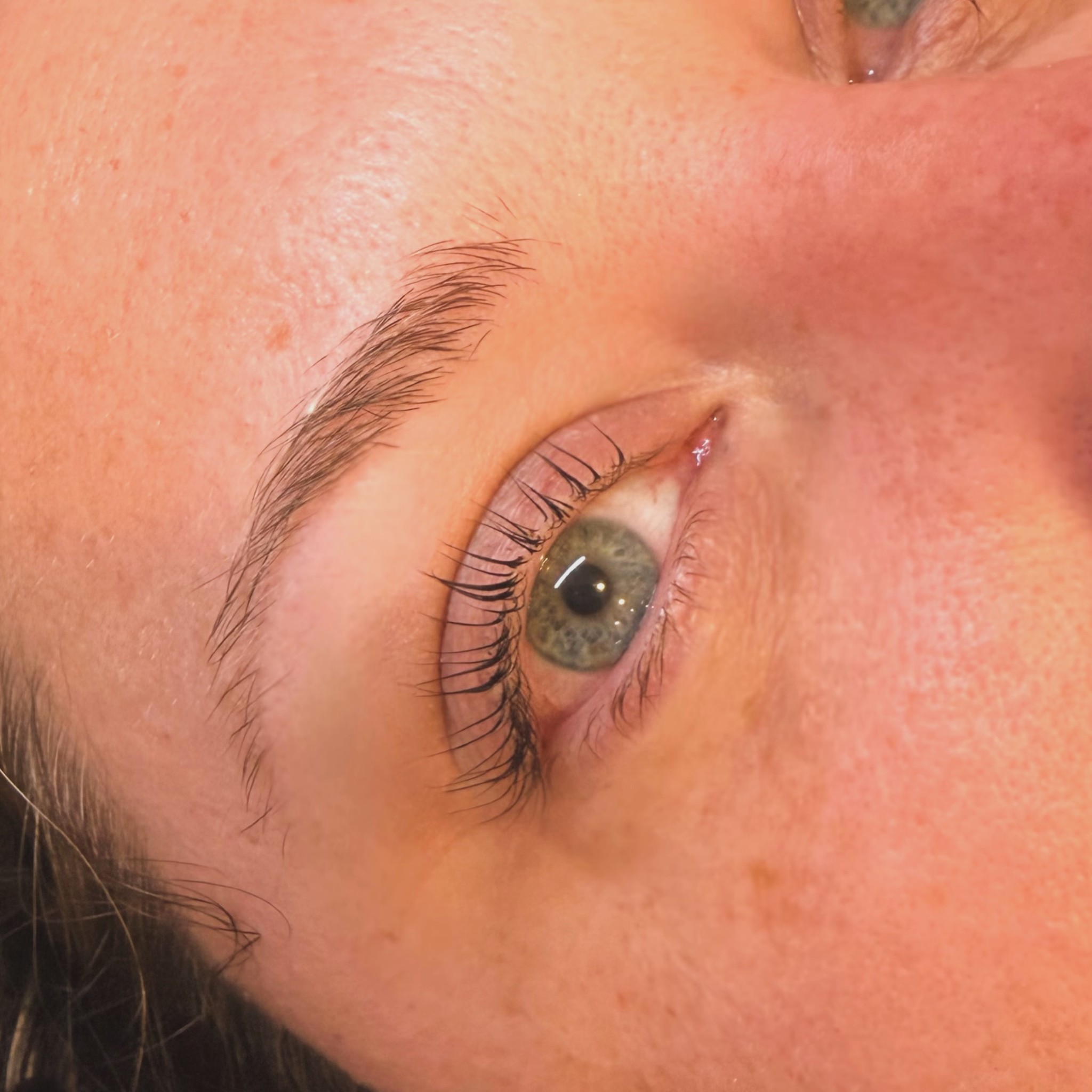 Natural lashes lifted and tinted after a Korean lash lift